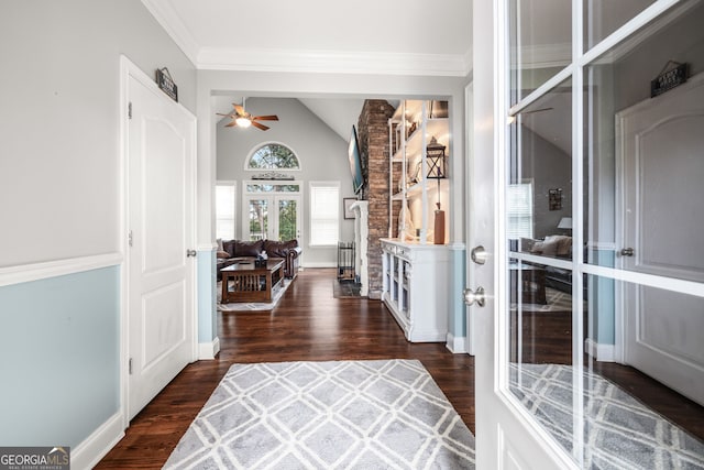 foyer with lofted ceiling, french doors, dark hardwood / wood-style floors, ornamental molding, and ceiling fan