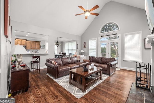 living room featuring ceiling fan, dark hardwood / wood-style flooring, and high vaulted ceiling