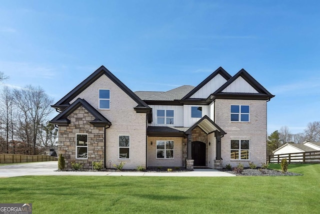 craftsman-style home featuring a front lawn