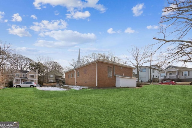 view of property exterior featuring a lawn