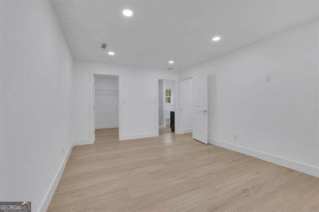 empty room with light hardwood / wood-style floors