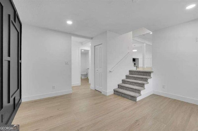 basement featuring light wood-type flooring