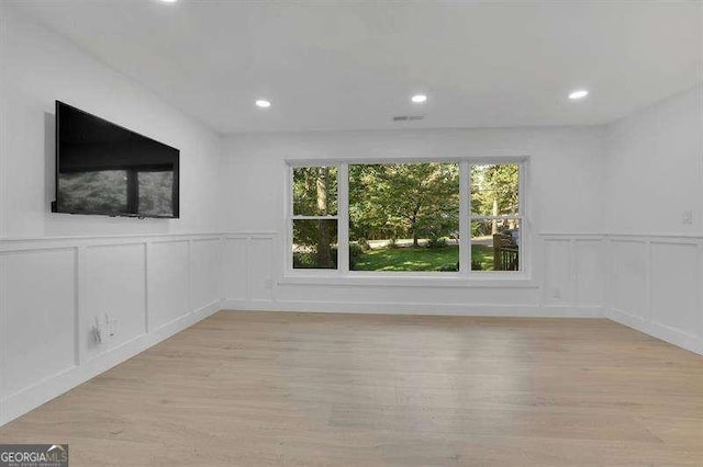 spare room featuring light wood-type flooring