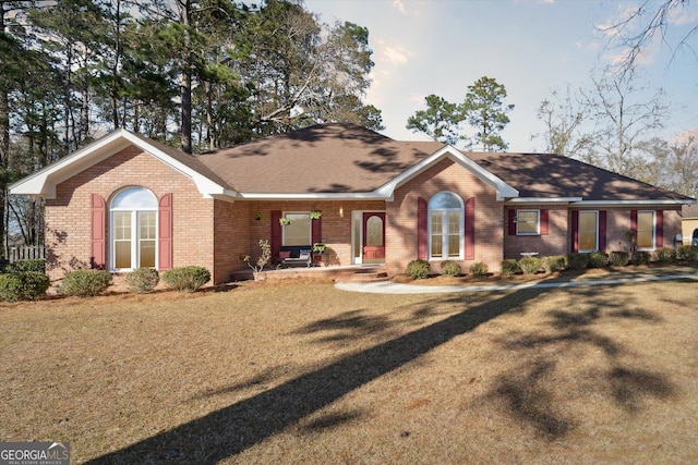 ranch-style house with a front lawn