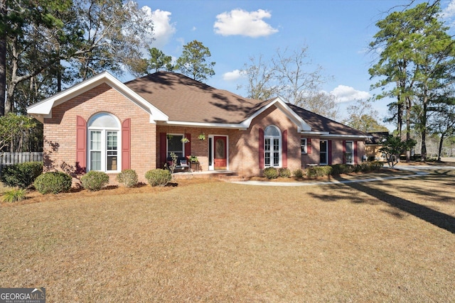 ranch-style house featuring a front yard and a porch