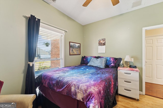 bedroom with ceiling fan and light hardwood / wood-style floors