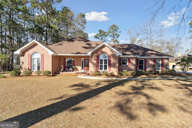 single story home with a front yard