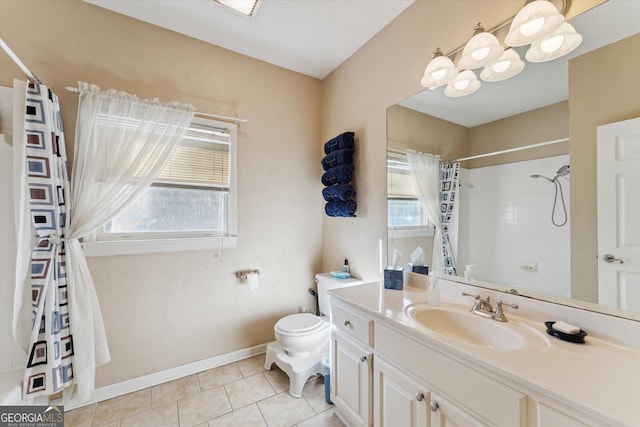 bathroom with a wealth of natural light, tile patterned floors, vanity, and a shower with shower curtain