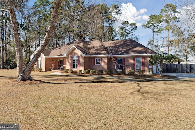 ranch-style house with a front lawn