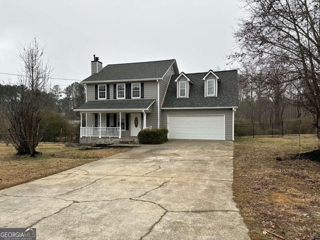 view of front facade with a porch and a garage