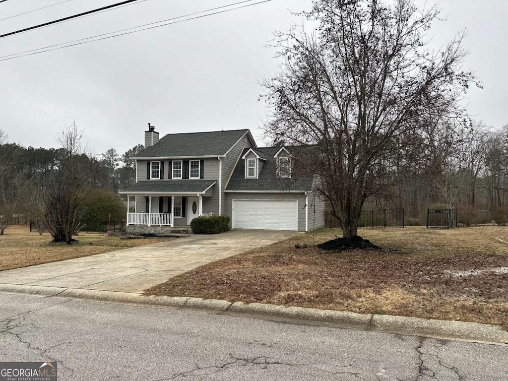 view of front facade with a garage and covered porch