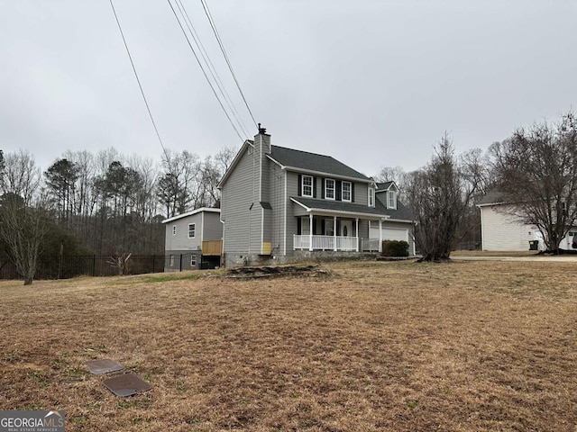 view of front facade featuring covered porch and a front lawn