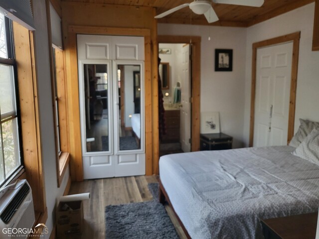 bedroom with ceiling fan, wooden ceiling, and hardwood / wood-style flooring