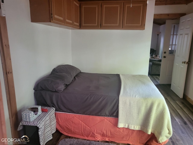 bedroom featuring dark hardwood / wood-style flooring