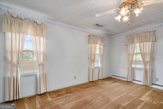 empty room featuring a textured ceiling, ceiling fan, and carpet flooring