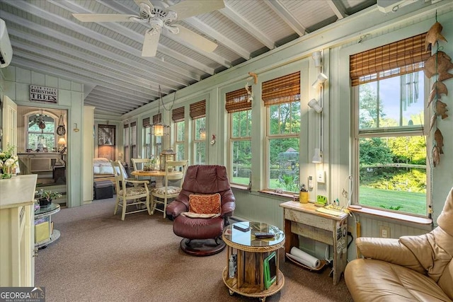 sunroom / solarium featuring ceiling fan