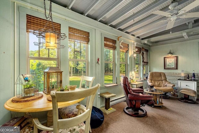 sunroom featuring ceiling fan, a baseboard heating unit, and lofted ceiling with beams