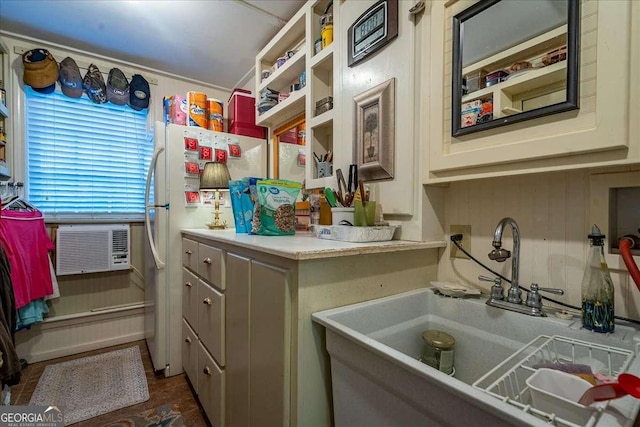 kitchen with sink, cooling unit, and white refrigerator