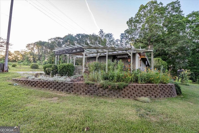 back of property with a pergola and a yard