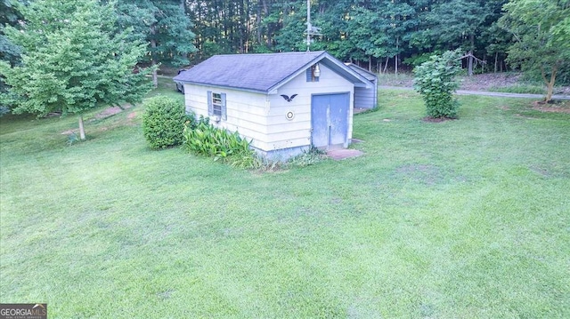 view of outdoor structure with a yard