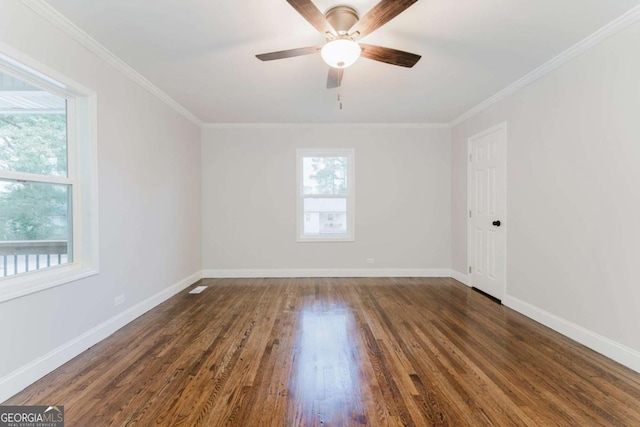 unfurnished room with dark wood-type flooring, plenty of natural light, ornamental molding, and ceiling fan