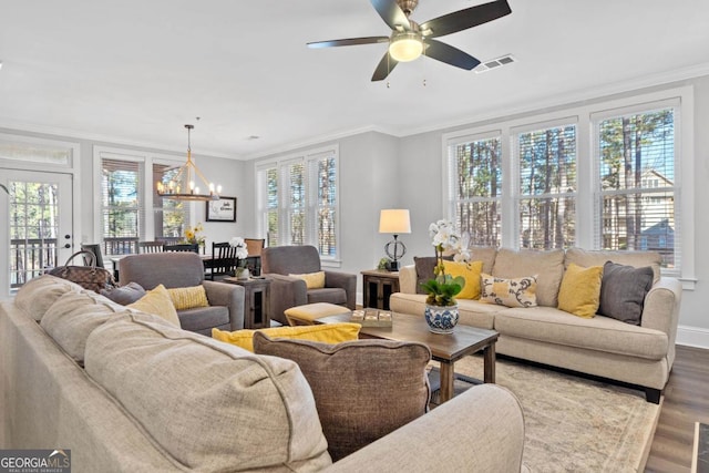 living room featuring crown molding, ceiling fan with notable chandelier, and hardwood / wood-style floors