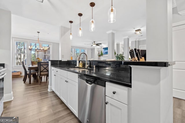 kitchen featuring dishwasher, hanging light fixtures, ceiling fan with notable chandelier, white cabinets, and sink