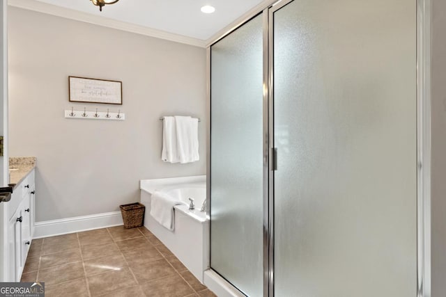 bathroom with tile patterned flooring, vanity, crown molding, and plus walk in shower