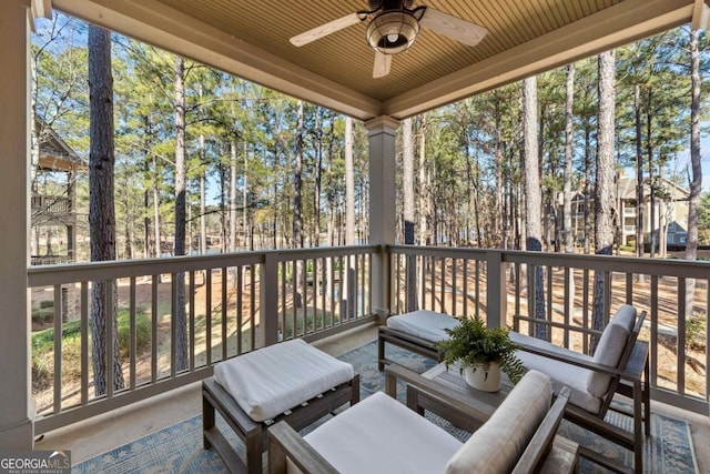 exterior space featuring ceiling fan and area for grilling