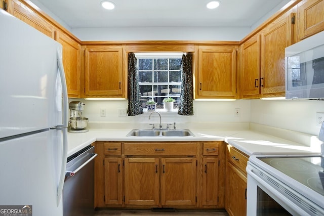 kitchen with sink and white appliances