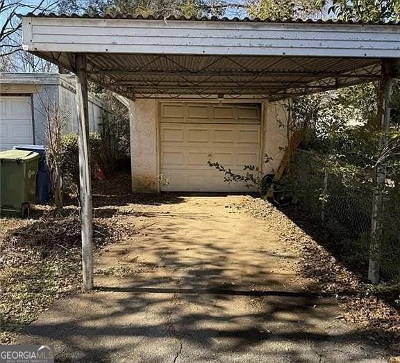 garage with a carport