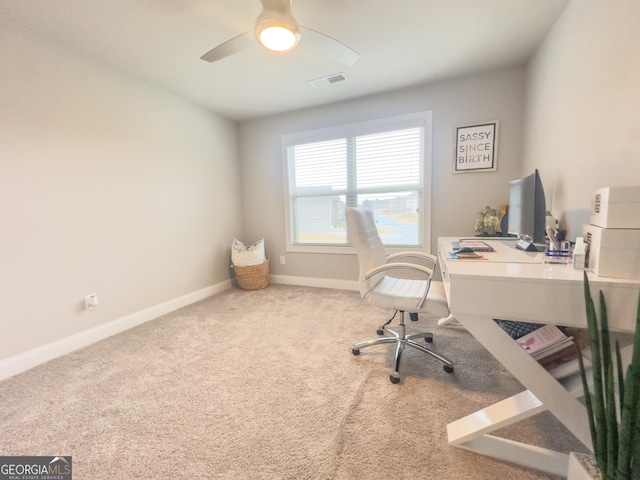 office with carpet floors and ceiling fan