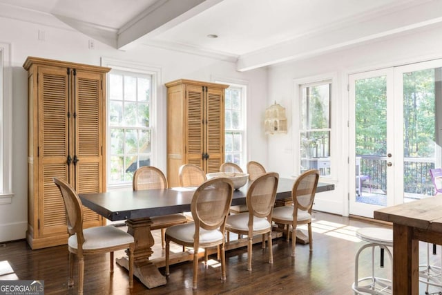 dining room with dark wood-type flooring, ornamental molding, and beamed ceiling