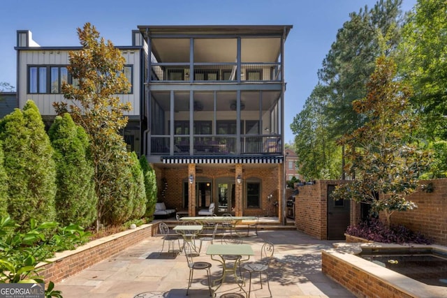 rear view of house featuring a patio