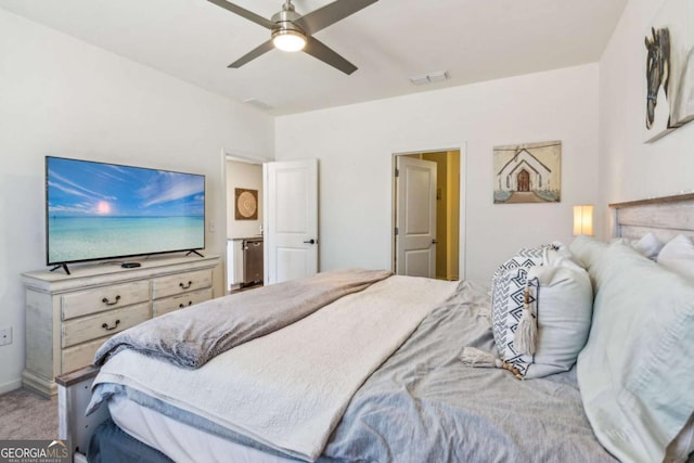 bedroom featuring ceiling fan and carpet