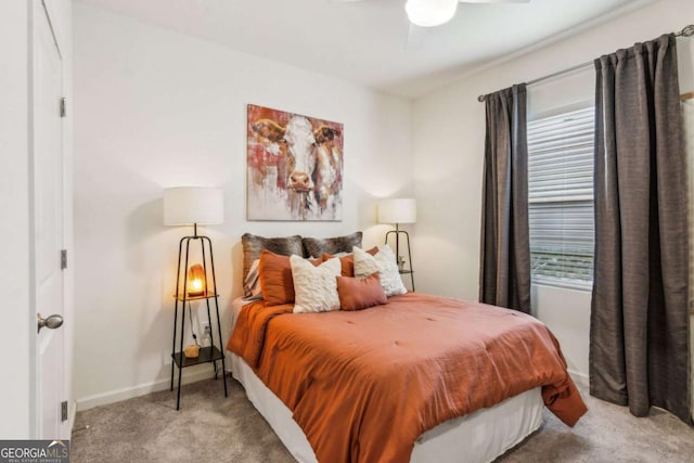 bedroom featuring ceiling fan and light carpet