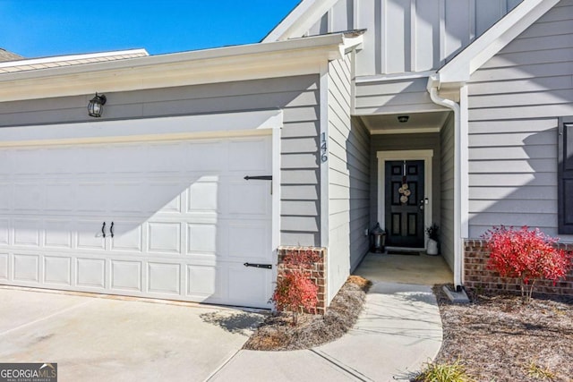 doorway to property featuring a garage