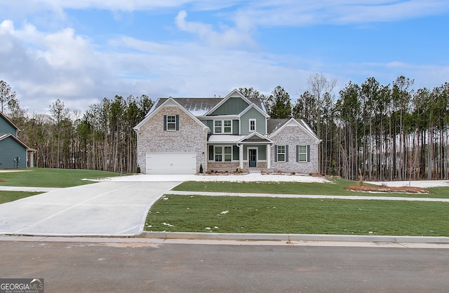 view of front of house with a garage and a front yard