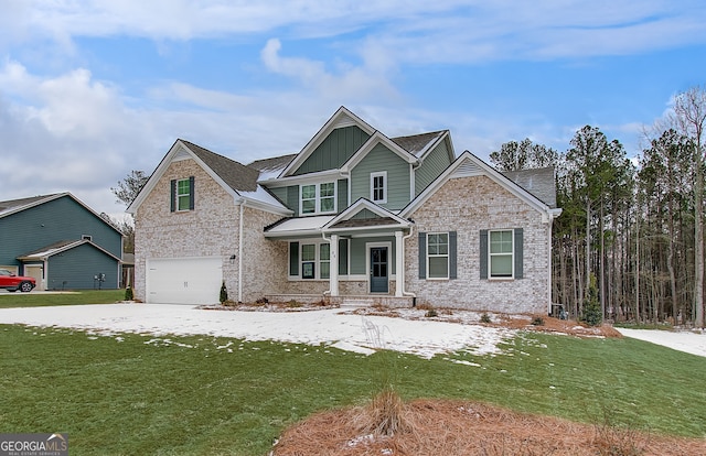 craftsman inspired home with a porch, a garage, and a front lawn