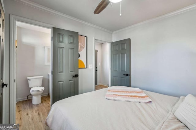 bedroom with ceiling fan, light hardwood / wood-style floors, ornamental molding, and ensuite bath