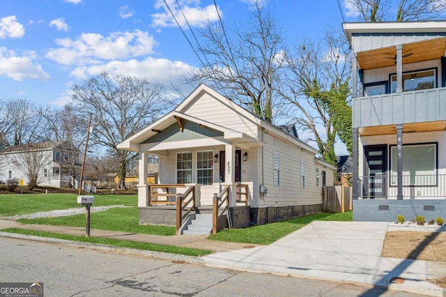 view of front of house featuring a front yard and a porch