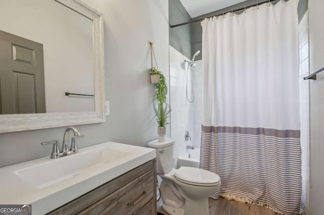 full bathroom with toilet, vanity, shower / tub combo with curtain, and hardwood / wood-style floors