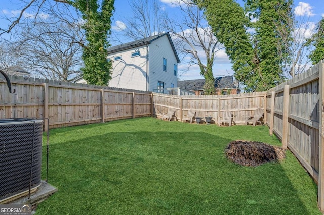 view of yard with central AC unit