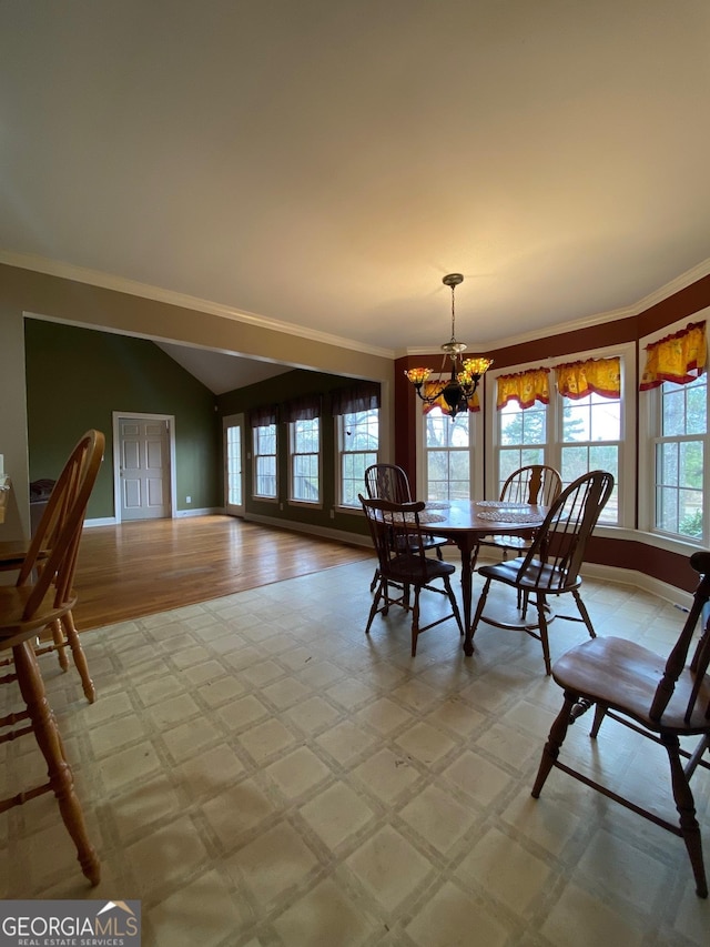 unfurnished dining area featuring crown molding and a chandelier