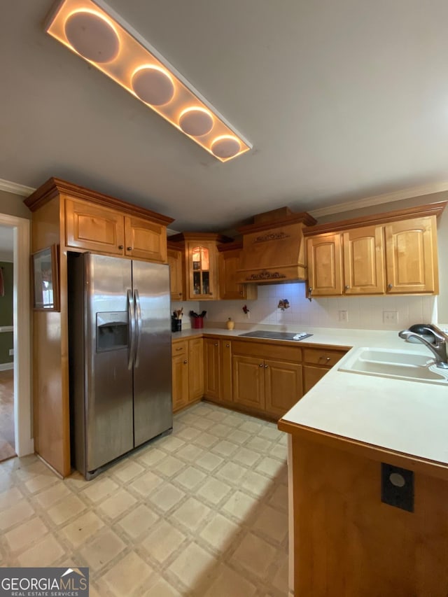 kitchen with sink, stainless steel refrigerator with ice dispenser, tasteful backsplash, black electric stovetop, and custom range hood