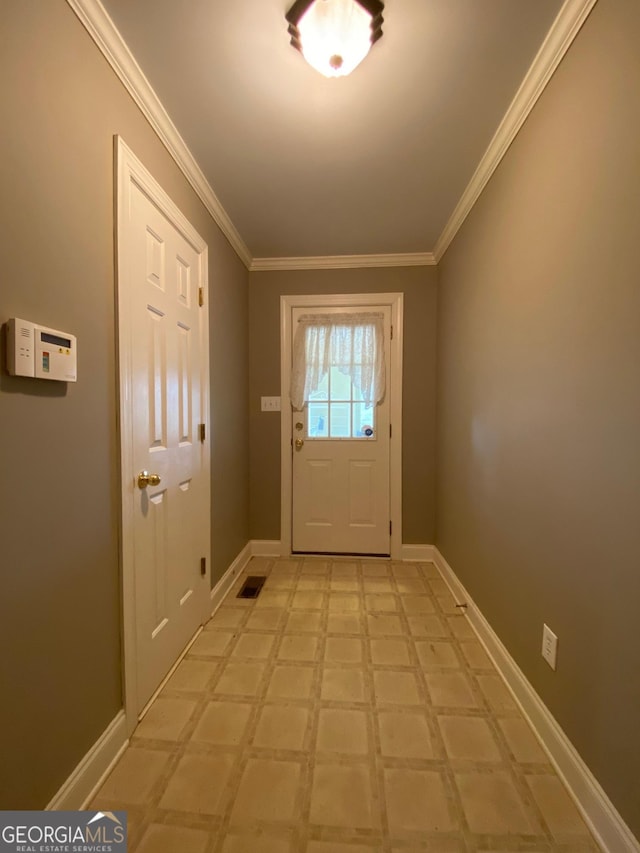 doorway to outside featuring crown molding