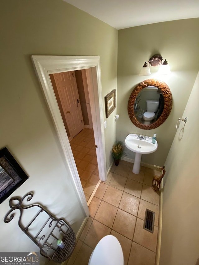 bathroom featuring sink and tile patterned flooring