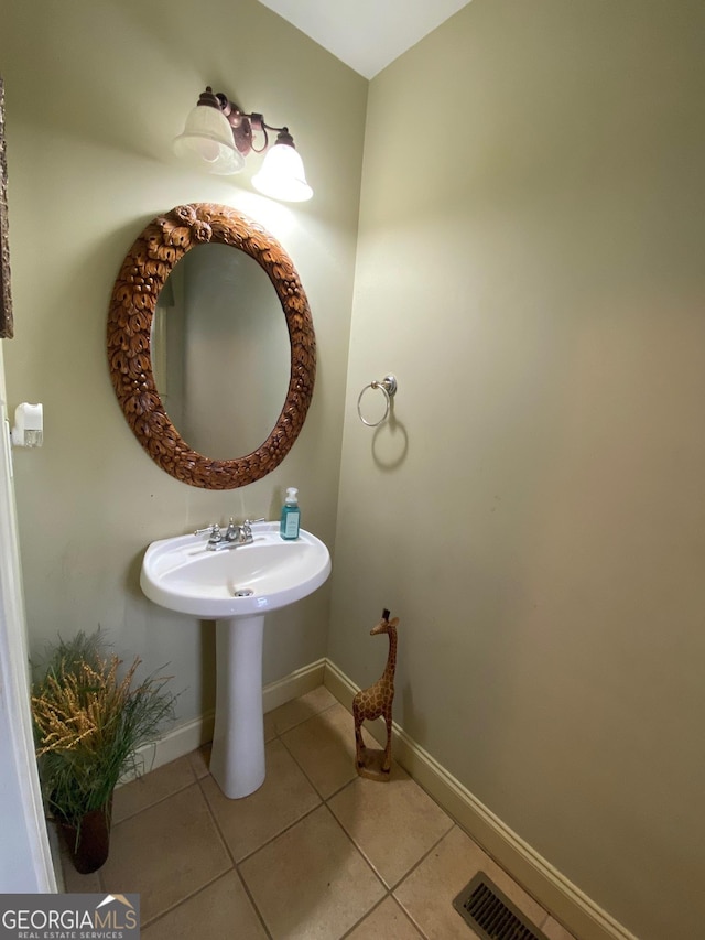 bathroom with tile patterned floors and sink