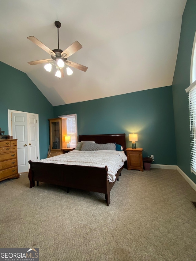 bedroom with vaulted ceiling, carpet flooring, and ceiling fan