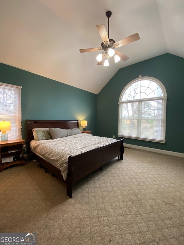 bedroom featuring vaulted ceiling, ceiling fan, and carpet